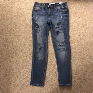 KanCan mid rise jegging open rips